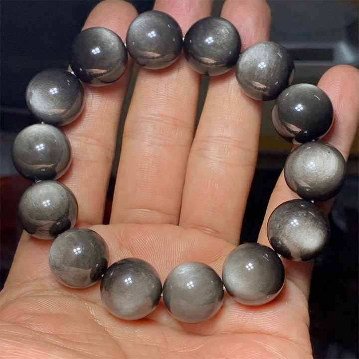 Braccialetto di protezione lenitiva in ossidiana lucida d'argento naturale Buddha Stones