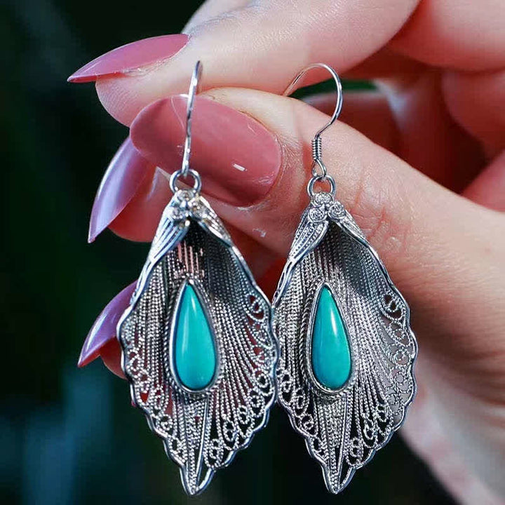 Orecchini pendenti con motivo a foglia di Bodhi in argento sterling 925 con Buddha Stones e turchese