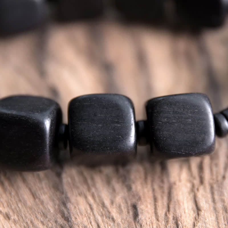 Braccialetto di forza con perline di legno di ebano tibetano Dzi Buddha Stones