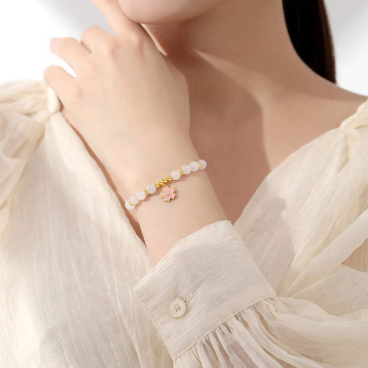 Braccialetto di protezione in giada bianca Hetian con fiori di ciliegio in argento sterling 925 Buddha Stones