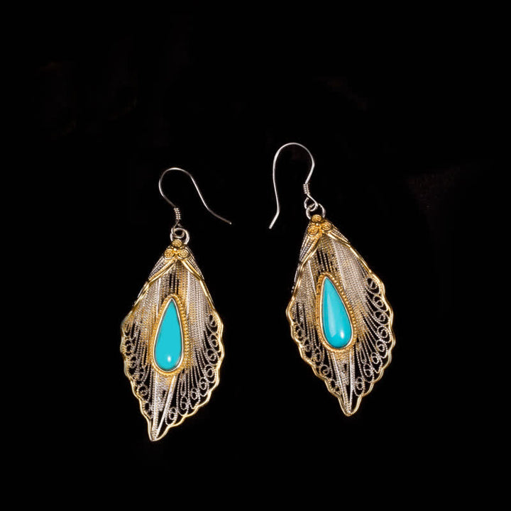 Orecchini pendenti con motivo a foglia di Bodhi in argento sterling 925 con Buddha Stones e turchese