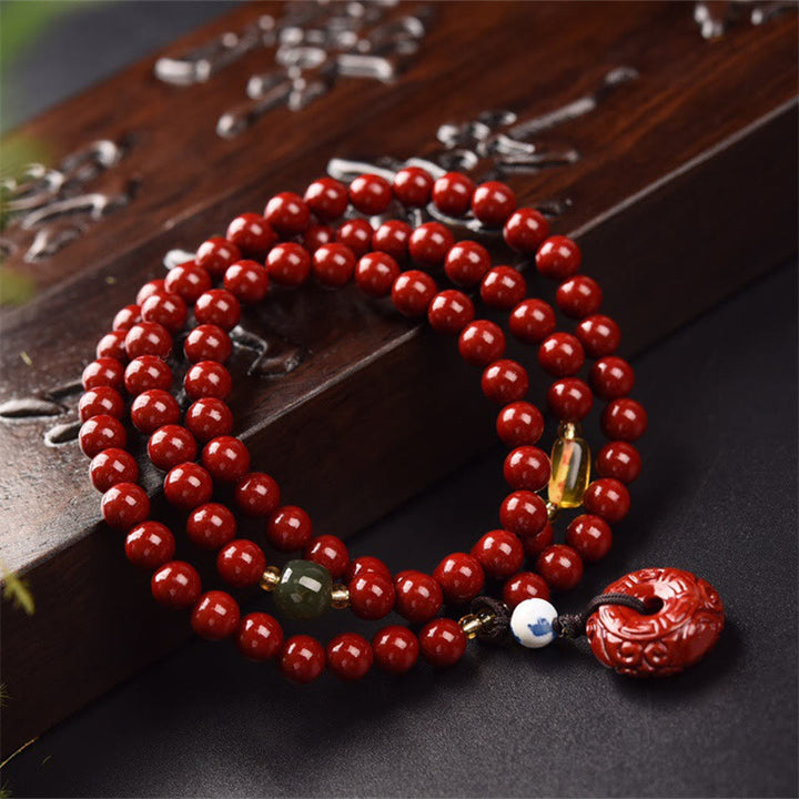 Braccialetto di benedizione a triplo giro con fibbia della pace in cinabro tibetano Buddha Stones Mala