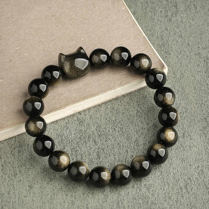 Braccialetto di protezione con gatto portafortuna e zampa adorabile , Buddha Stones, ossidiana lucida d'oro, ossidiana lucida d'argento - Ossidiana lucente dorata - Testa di gatto - 10 millimetri - image 9