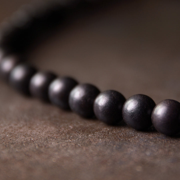 Braccialetto di coppia di protezione in rame con perline di Dzi in legno di ebano Buddha Stones