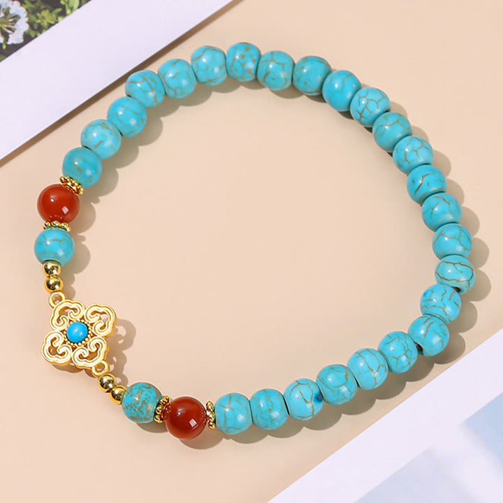 Braccialetto di protezione dell'equilibrio con perline turchesi Buddha Stones