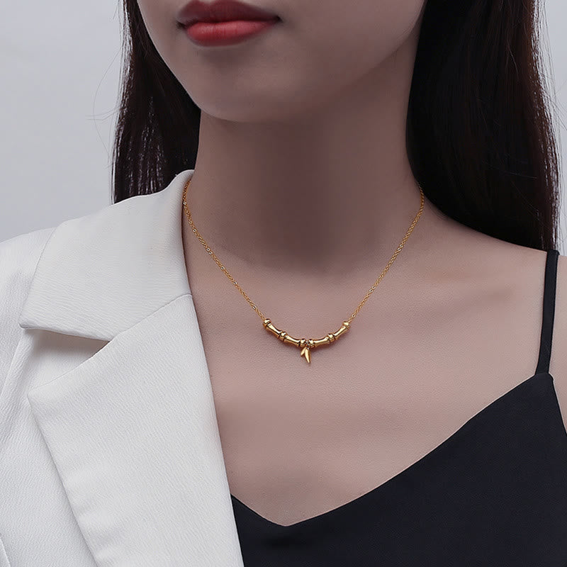 Collana con ciondolo in acciaio al titanio con motivo a bambù dorato Buddha Stones