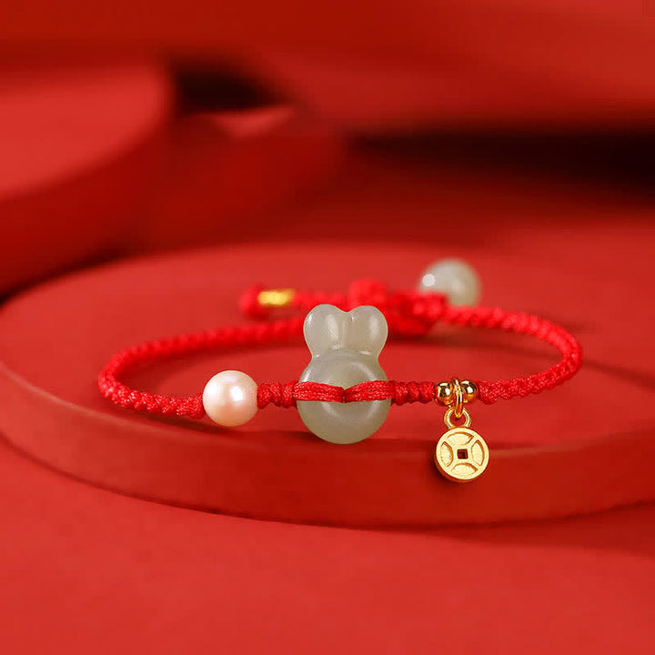 Braccialetto in corda rossa con moneta di rame e giada di Hetian dell'anno del coniglio in argento sterling 925