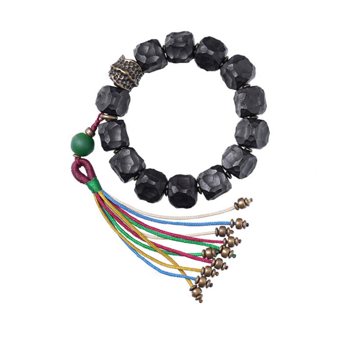Bracciale Mala da polso con nappa in legno di Buddha Stones tibetano e rame della pace
