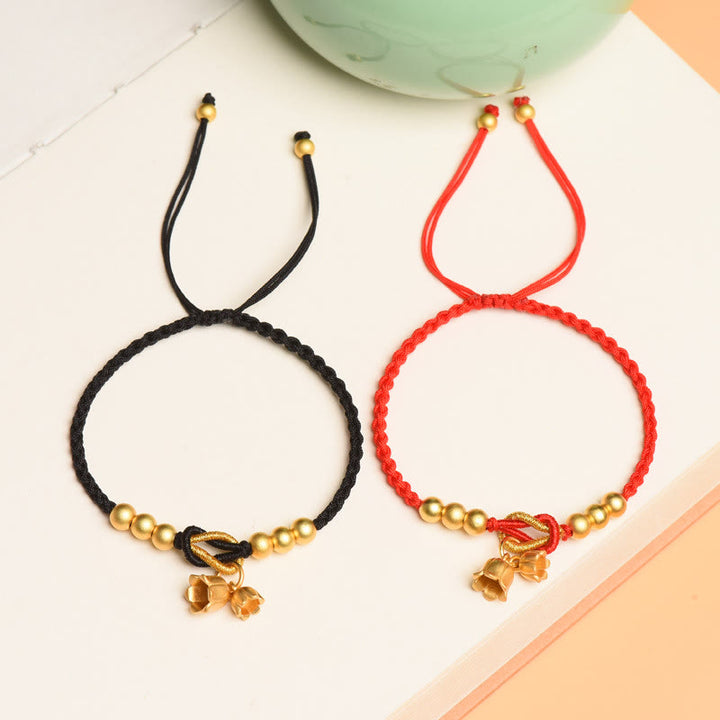 Bracciale intrecciato con ciondolo a forma di fiore di mughetto fatto a mano con Buddha Stones e protezione dalla fortuna