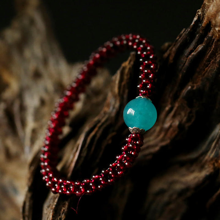Braccialetto di protezione con perline di agata rossa, cristallo rosa e granato naturale Buddha Stones