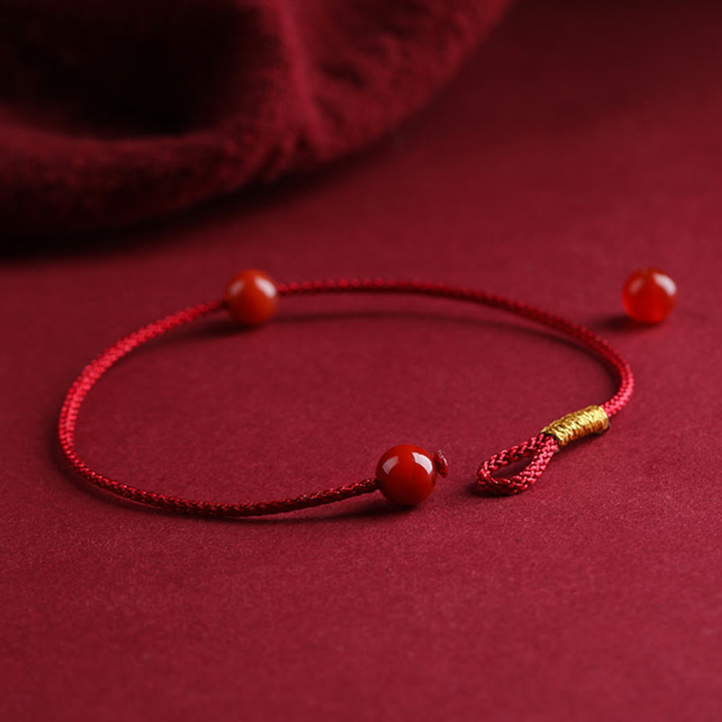 Braccialetto di corda rossa con benedizione in agata rossa naturale e cinabro Buddha Stones
