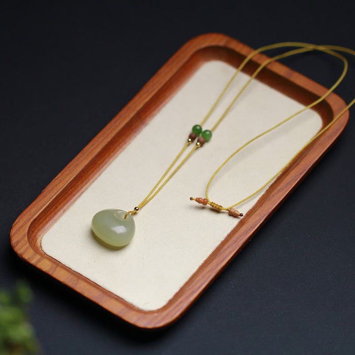 Collana con ciondolo in corda della prosperità con motivo a piccola borsa in giada naturale di Hetian