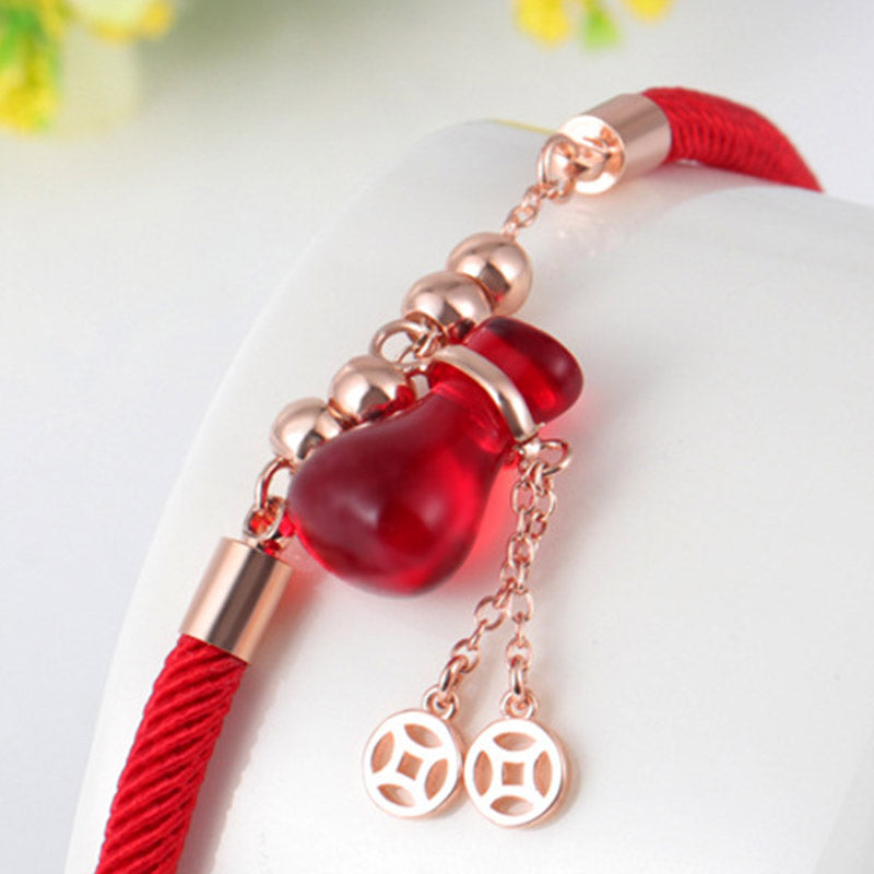 Braccialetto Buddha Stones Wealth Attractor con corda rossa e agata rossa