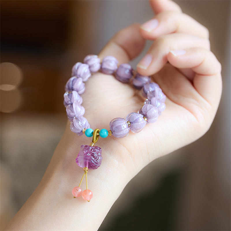 Braccialetto dell'illuminazione con ciondolo leone danzante avorio, perline di vetro Liuli, motivo loto, fluorite e Buddha Stones