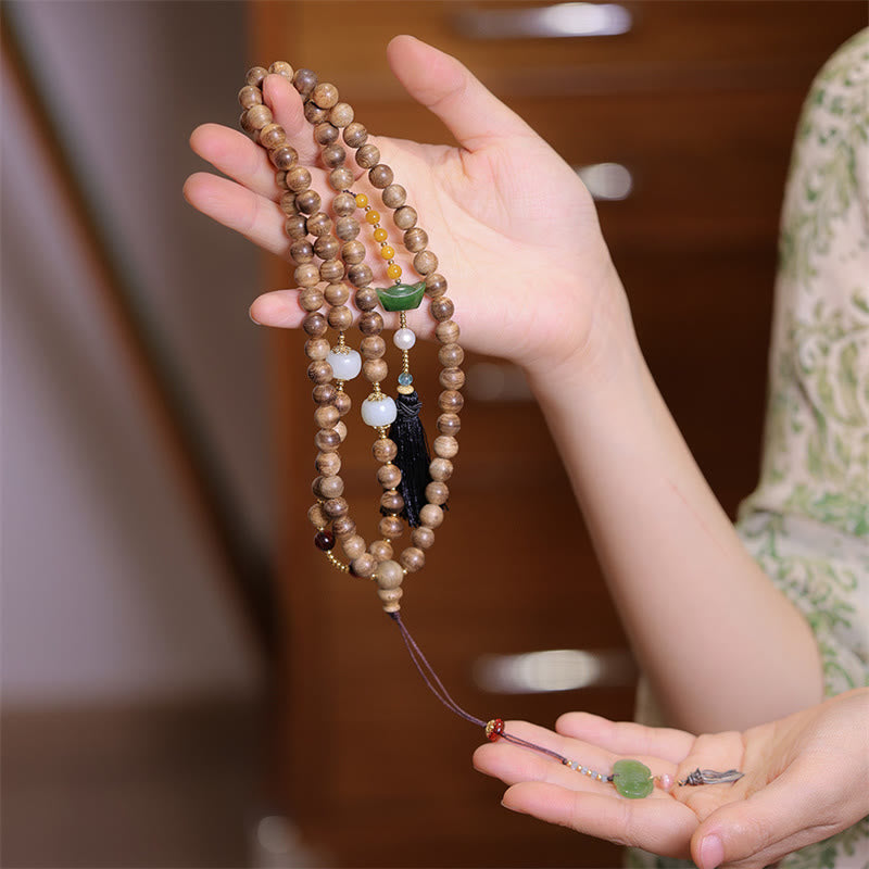 Braccialetto con ciondolo Ruyi in lingotto di giada ambrato naturale con Buddha Stones agarwood