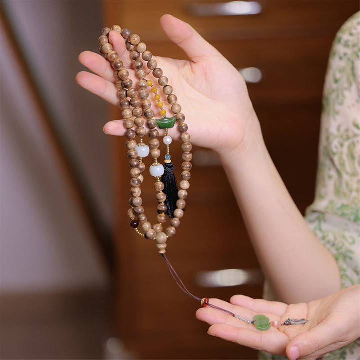 Braccialetto con ciondolo Ruyi in lingotto di giada ambrato naturale con Buddha Stones agarwood