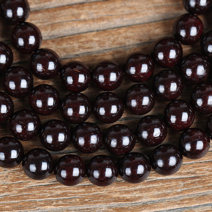 Braccialetto di protezione con nodo cinese in legno di sandalo rosso con piccola foglia e stella d'oro Buddha Stones
