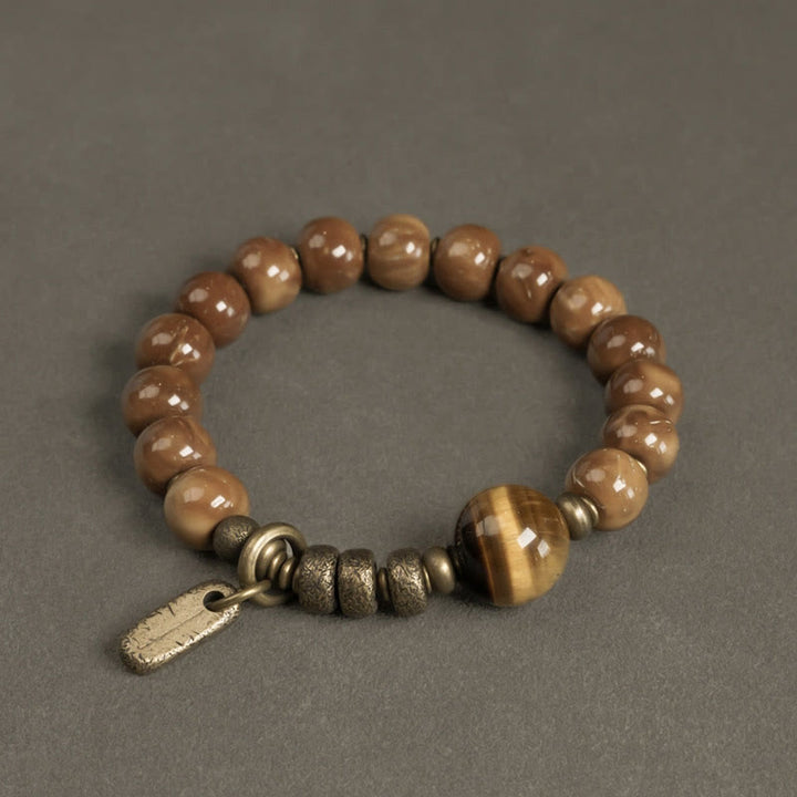 Braccialetto per la fortuna, in ottone, rame e ossidiana , Buddha Stones , semi di Kuka, occhio di tigre e oro lucido - Kuka Seed&Tiger Eye - 17-17,5 cm - image 0