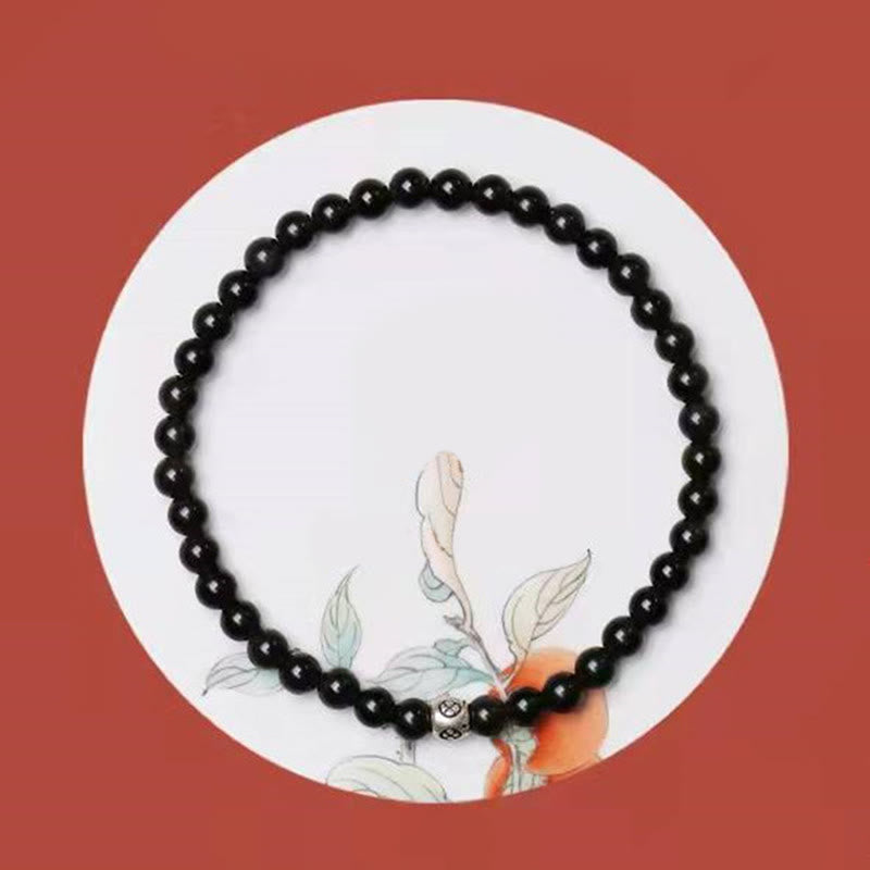 Bracciale Buddha Stones in ossidiana nera naturale e quarzo fumé per la forza di purificazione