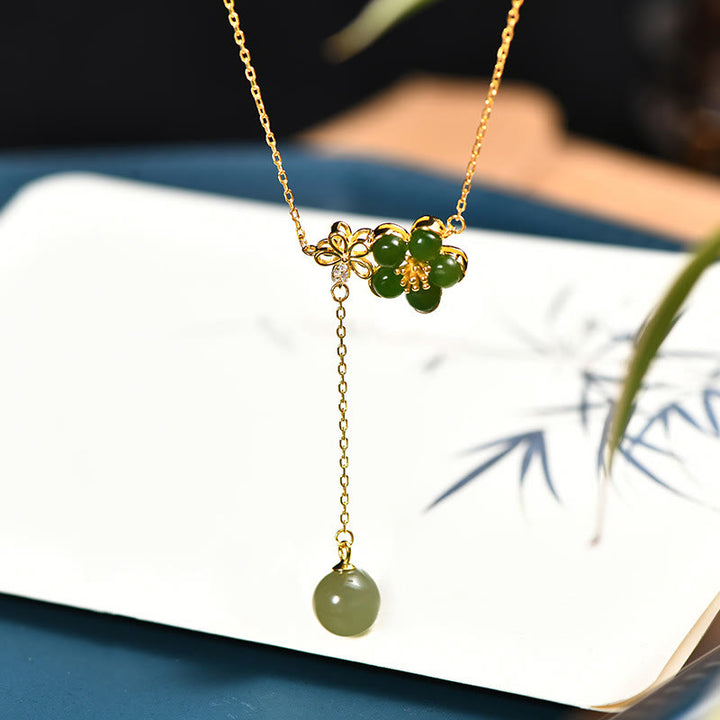 Collana con ciondolo portafortuna in argento sterling 925 con fiore di prugna in giada ciano Hetian, motivo Buddha Stones