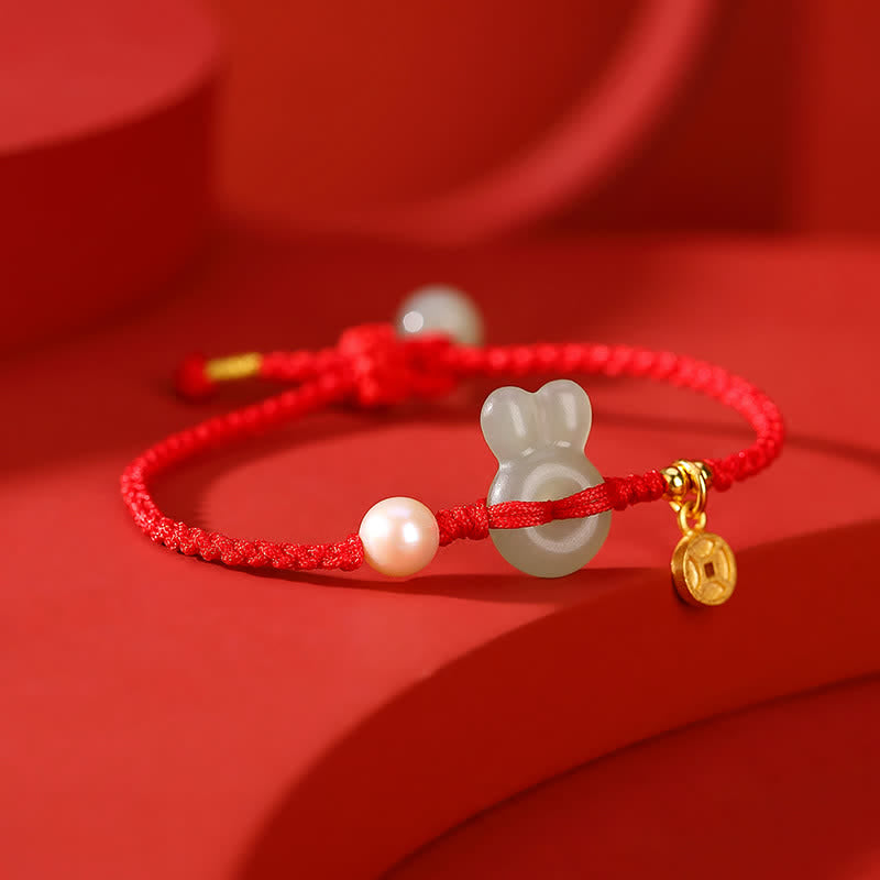 Braccialetto in corda rossa con moneta di rame e giada di Hetian dell'anno del coniglio in argento sterling 925