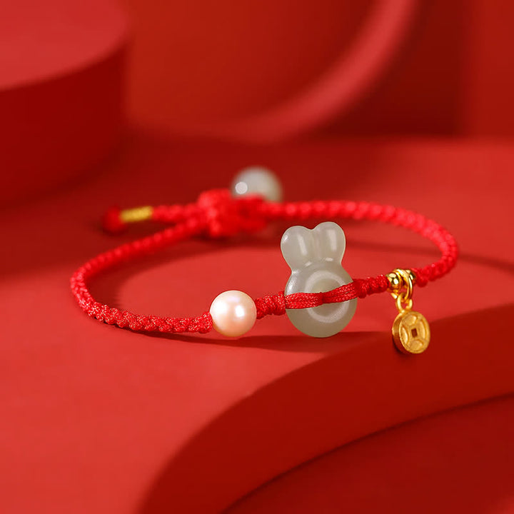 Braccialetto in corda rossa con moneta di rame e giada di Hetian dell'anno del coniglio in argento sterling 925