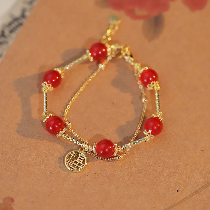 Braccialetto di accettazione di sé con ciondolo a forma di carattere Fu in agata rossa Buddha Stones