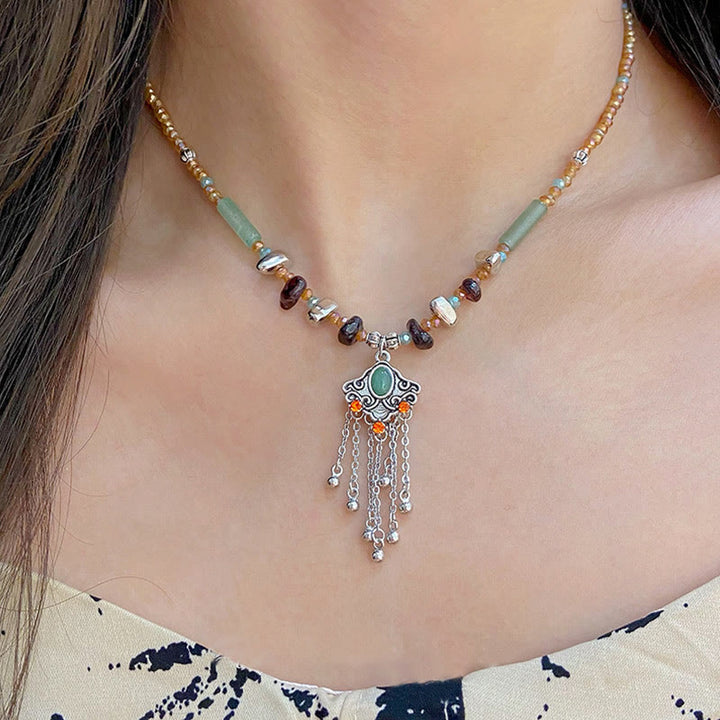 Buddha Stones Pietra di cristallo tibetana Collana pendente con nappa portafortuna in rame