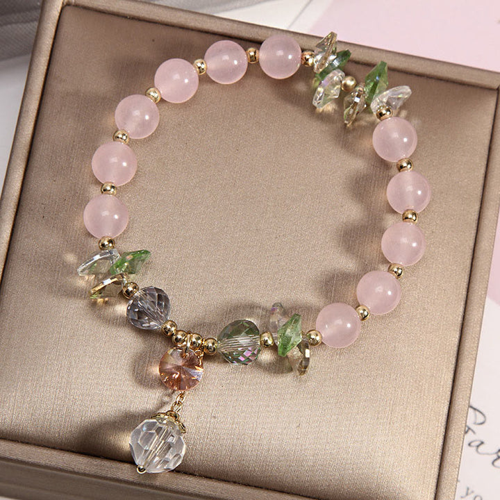 Braccialetto con ciondolo di pace in cristallo rosa con occhio di gatto Buddha Stones
