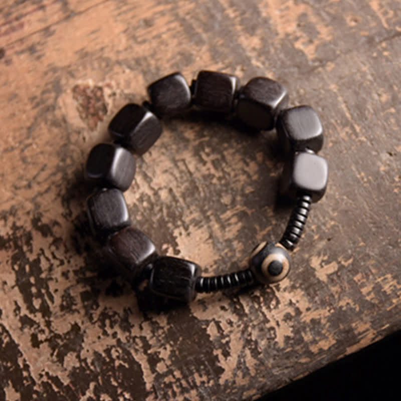 Braccialetto di forza con perline di legno di ebano tibetano Dzi Buddha Stones