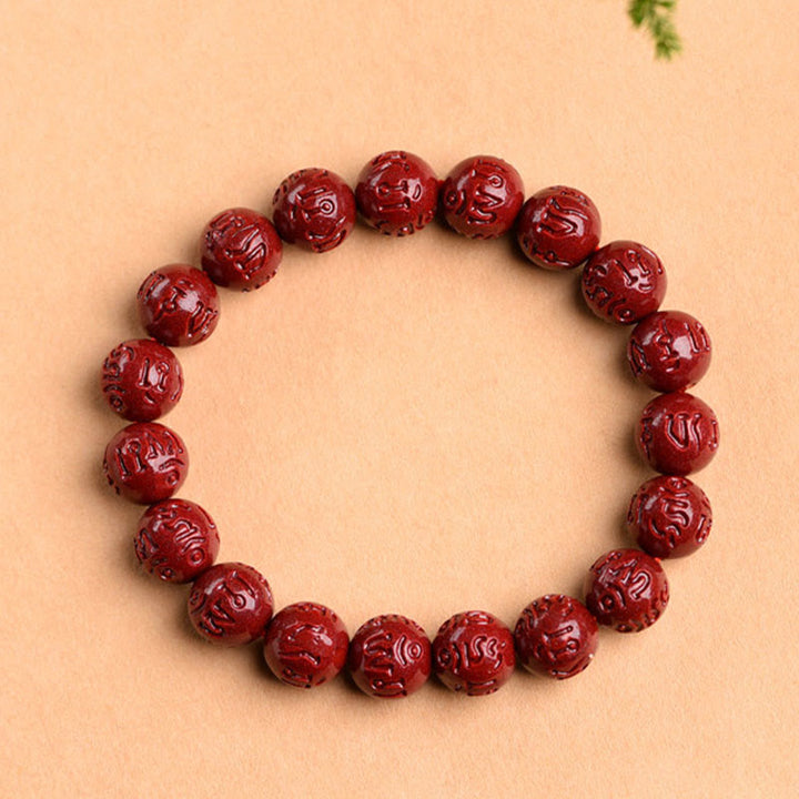 Braccialetto di benedizione del loto con motivo a fregi in cinabro naturale Om Mani Padme Hum Buddha Stones