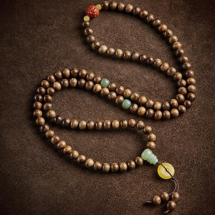 Buddha Stones 108 perle di Mala Kalimantan Agarwood Zucca Giada Ambra Bracciale equilibrio