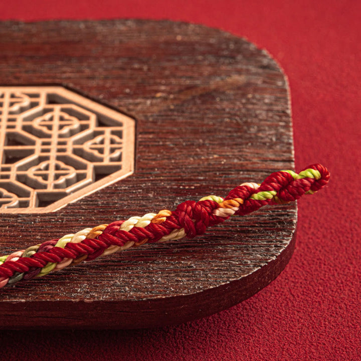 Bracciale multicolore Buddha Stones "Possa tu essere al sicuro e fortunato nell'anno a venire"