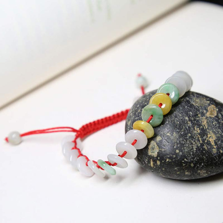 Braccialetto intrecciato con corda rossa portafortuna in giada rotonda Buddha Stones