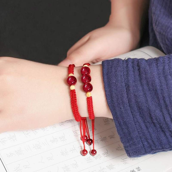 Braccialetto rosso con corda e cinabro per bambini, con Buddha Stones
