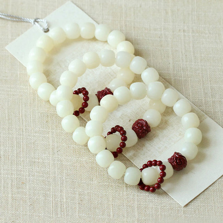 Buddha Stones Semi di Bodhi naturale Cinabro Leone danzante Charm Saggezza Armonia Polso Mala